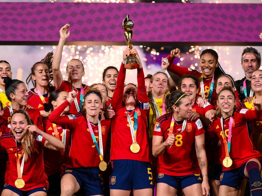 Spain's women's team celebrates with the World Cup trophy.