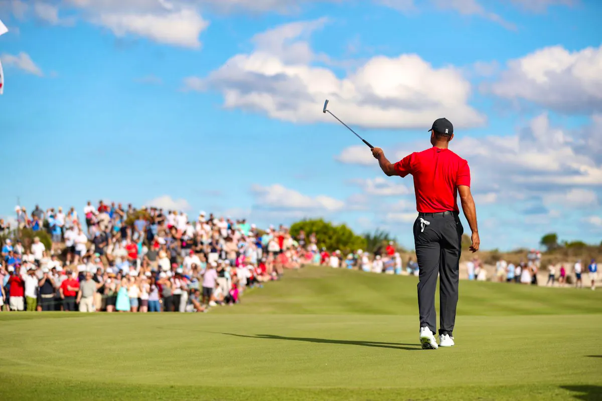 Tiger Woods signals to the crowd during the Hero World Challenge 2022 competition.