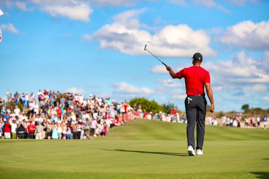 Tiger Woods signals to the crowd during the Hero World Challenge 2022 competition.