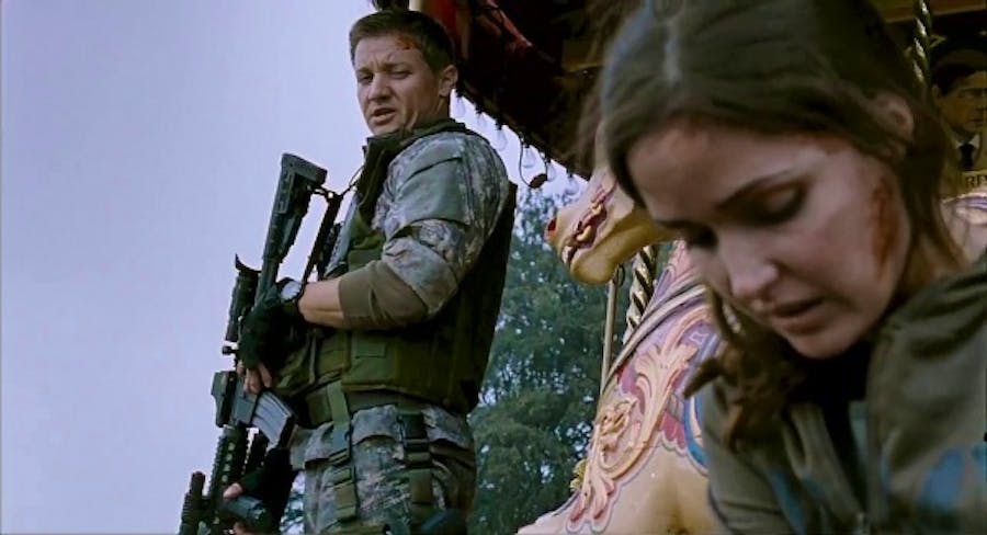 Jeremy Renner as a soldier, Rose Byrne as a scientist, having a quiet moment by a carousel
