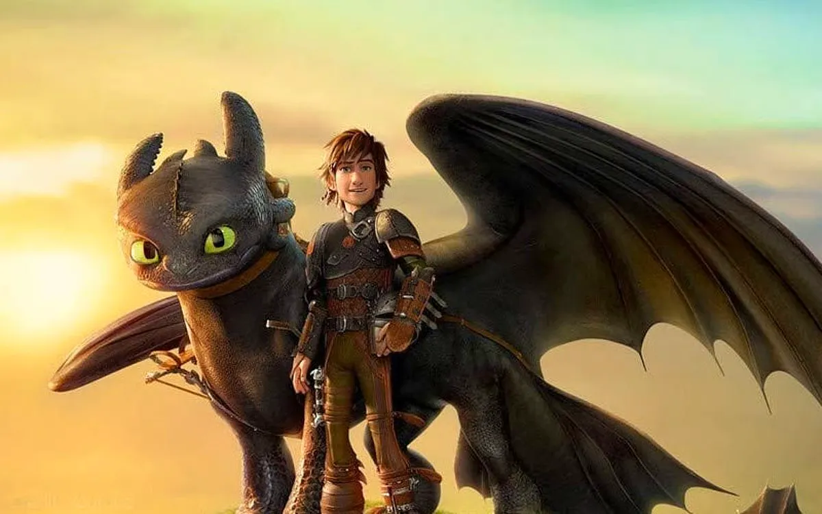 Toothless, a sleek black, catlike dragon, stands beside Hiccup, his best friend