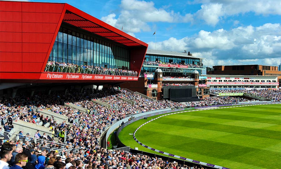 Fans look on at the action at the Old Trafford Cricket Ground.