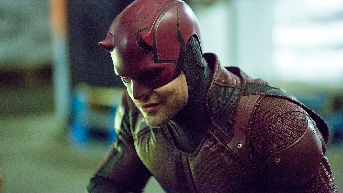 Daredevil, in full red costume, smiles