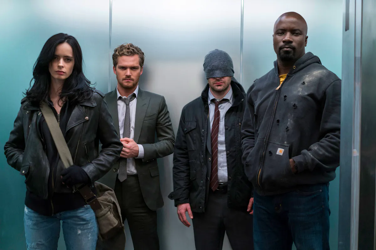 The Defenders - Jessica Jones, Iron Fist, Daredevil and Luke Cage - assembled in an elevator