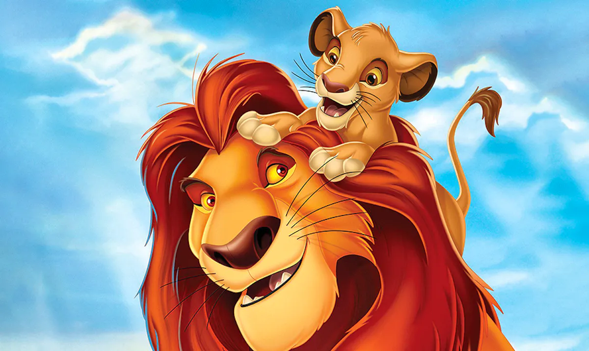 Mufasa, a wise and noble lion, looks back fondly at his young son Simba, who is climbing playfully on his head
