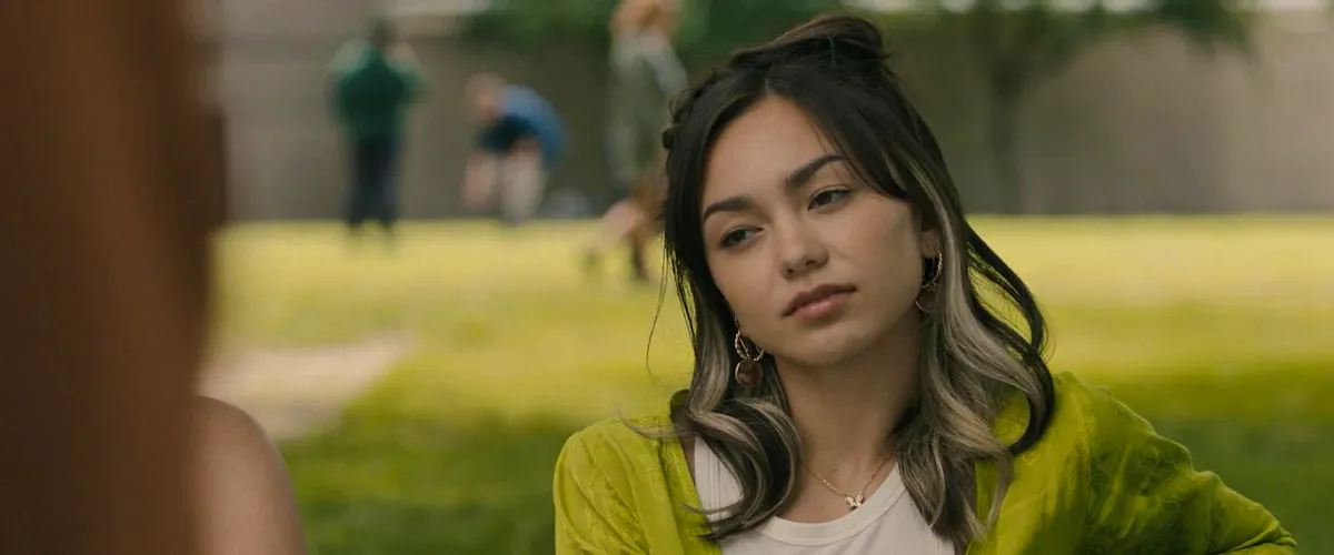 Anika, played by Devyn Nekoda, on a park bench