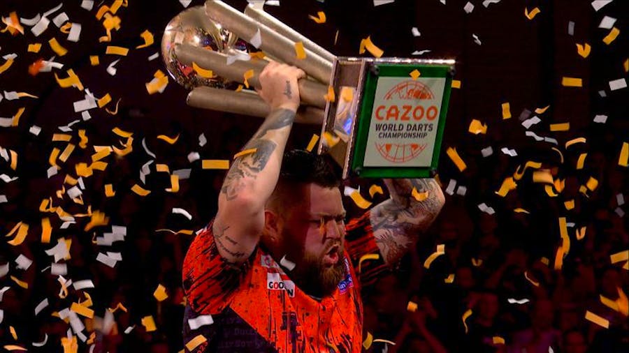 England's Michael Smith lifts the Cazoo World Darts Championship trophy after winning the latest edition.
