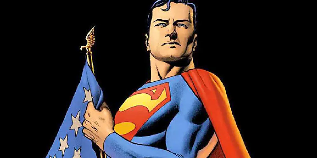 Superman stands with the American flag