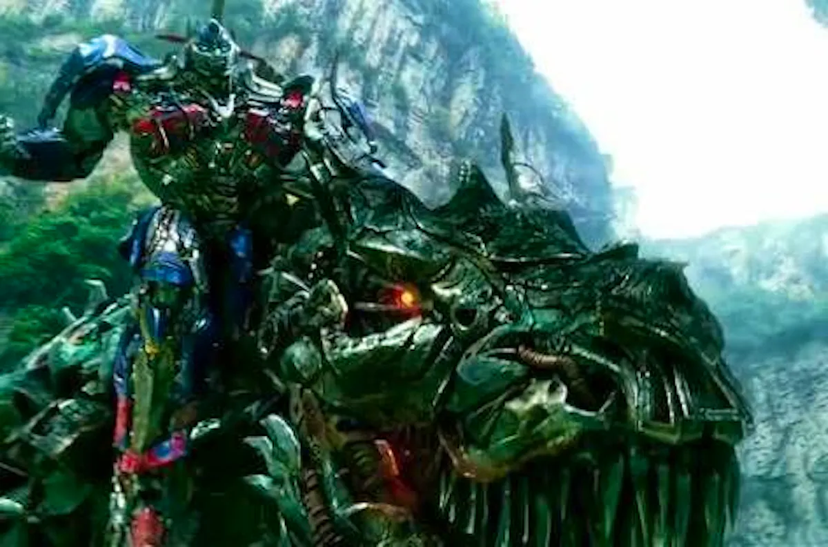 Optimus Prime on the back of a giant robot dinosaur